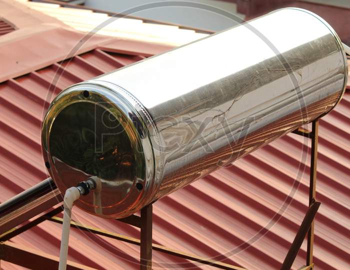 Solar Water Heater Tank Installed On The Top Of The Roof Of A Building