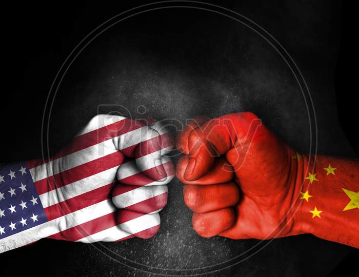 Conflict Between Usa And China, Male Fists With Flags Painted On Skin Isolated On Black Background - Governments Conflict Concept