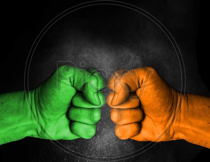 Conflict Between India And Pakistan, Male Fists With Flags Painted On Skin Isolated On Black Background - Governments Conflict Concept