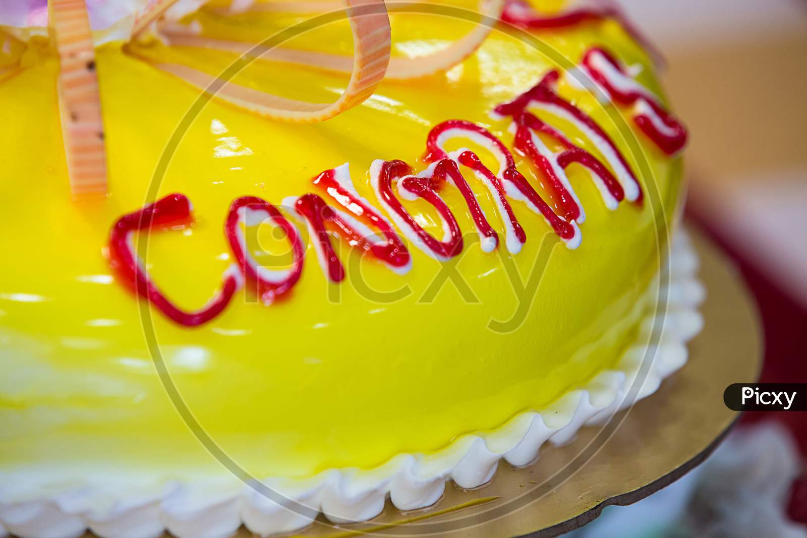 Yellow Pineapple Cake With Congrats Written On It, Background