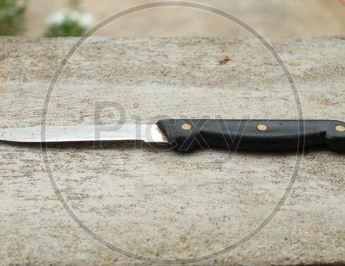 Steel Knife With A Plastic Handle.
