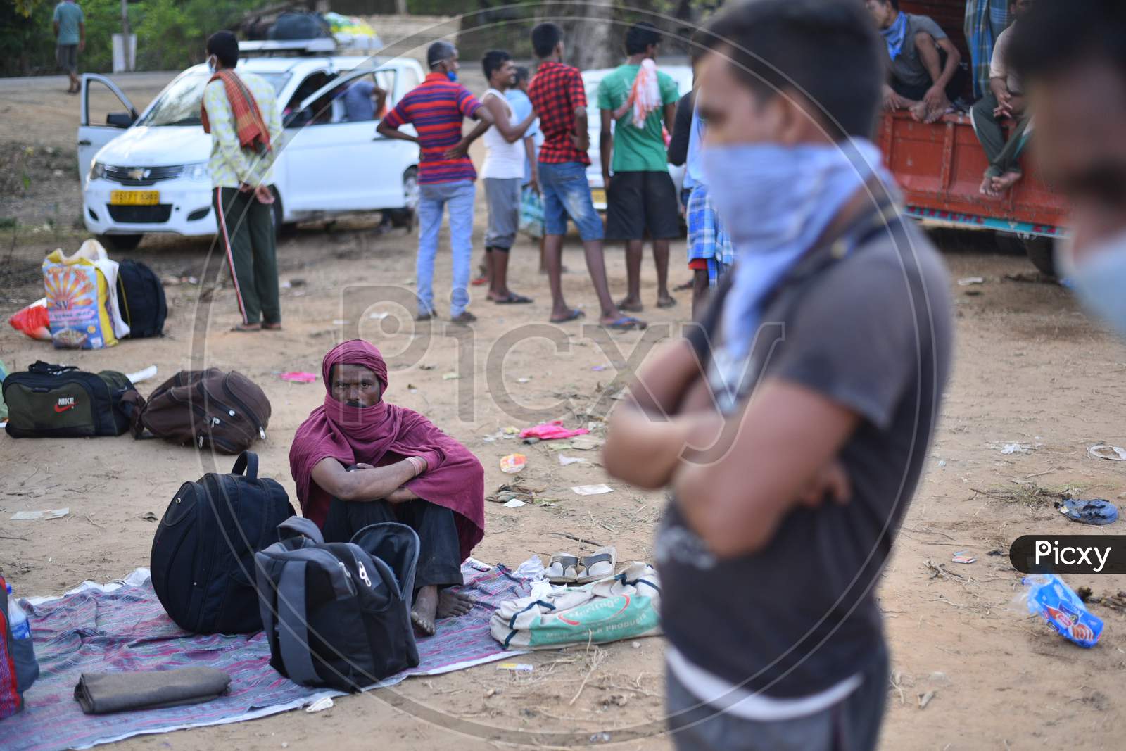 Scores of Migrant workers wait at Aswaraopet Check Post (Telangana- Andhra Border)  in a bid to reach their home states during an extended lockdown amid Coronavirus Pandemic. May 16,2020.
