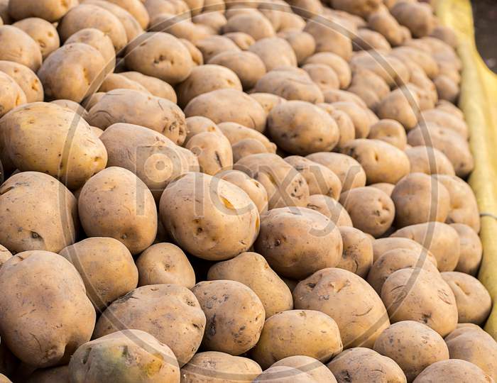 Potatoes Close Up Shot, Lots Of Organic Potatoes In Market