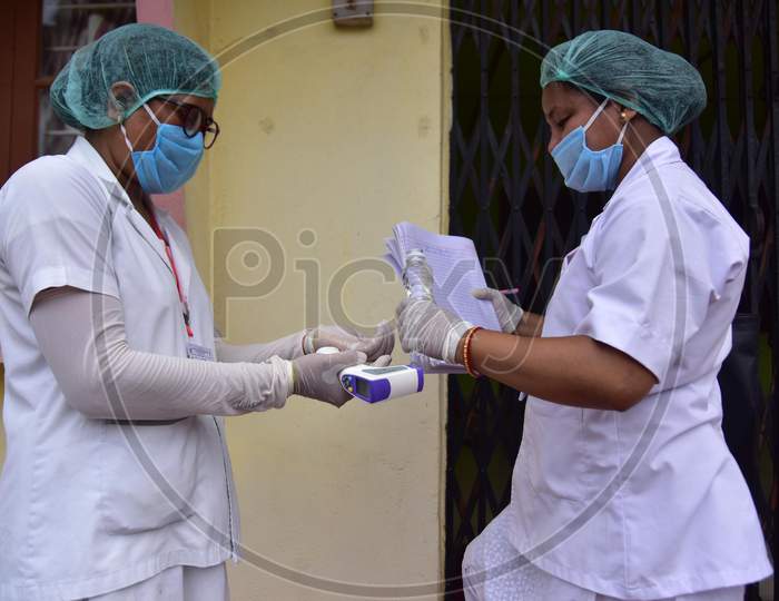 Health Worker Applies Sanitizer While Conducting  House To House Health Survey  House To House Health Survey  During Nationwide Lockdown Amidst Coronavirus or COVID-19 Pandemic  In Nagaon District Of Assam,India