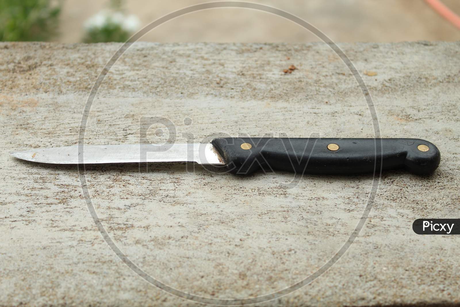Steel Knife With A Plastic Handle.