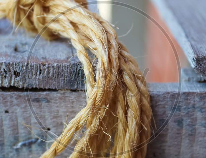 Old rope bound around an old vintage box in a close up view