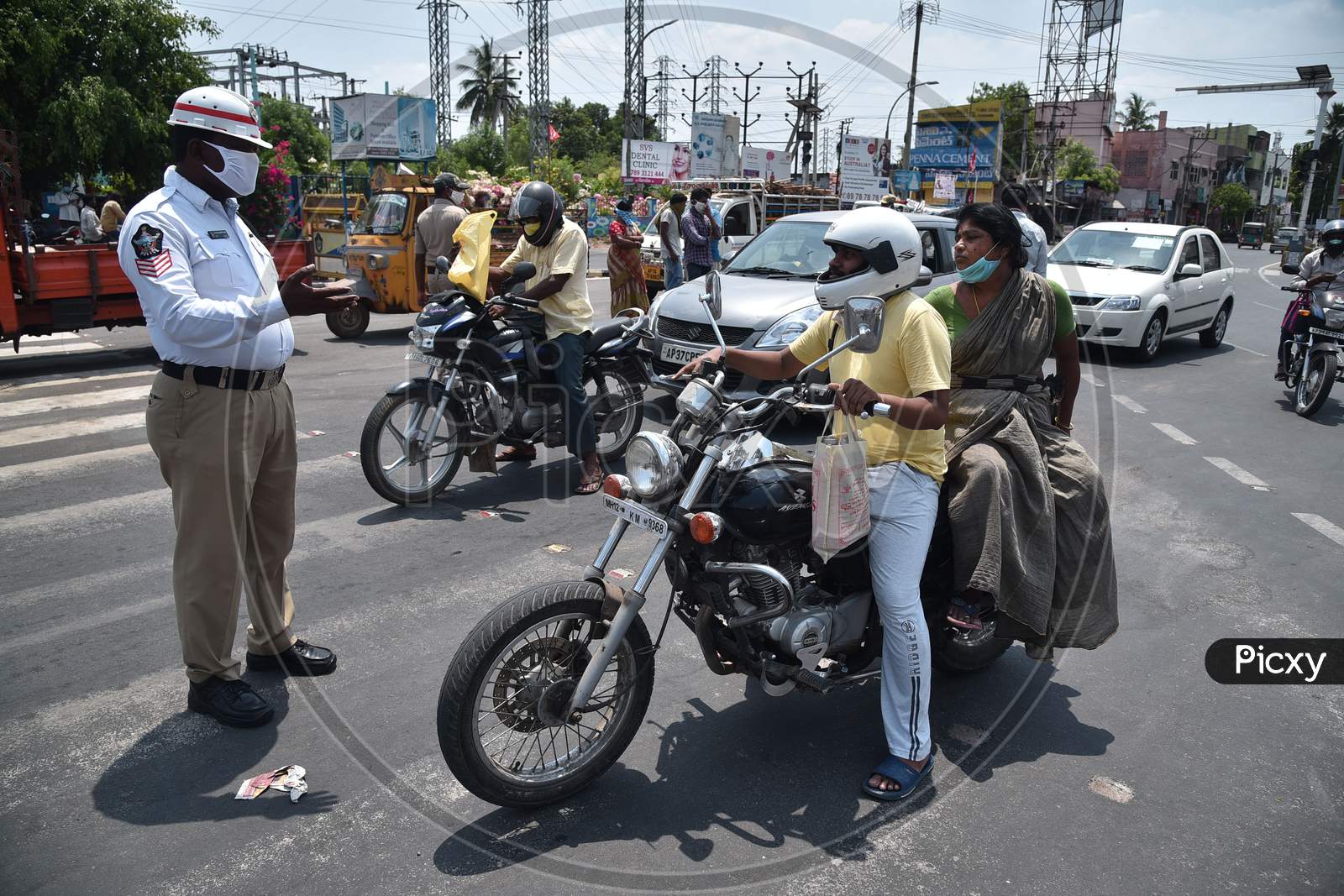 Traffic Police Personnel Question The Commuters During The Nationwide Lockdown Amid Coronavirus Pandemic In Vijayawada.