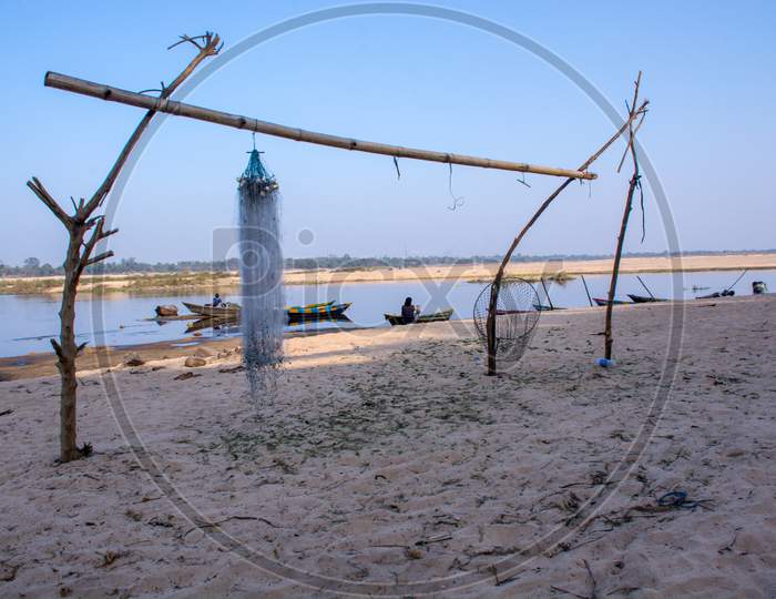hanfging fishing net boats and damodar river near bardhaman west bengal