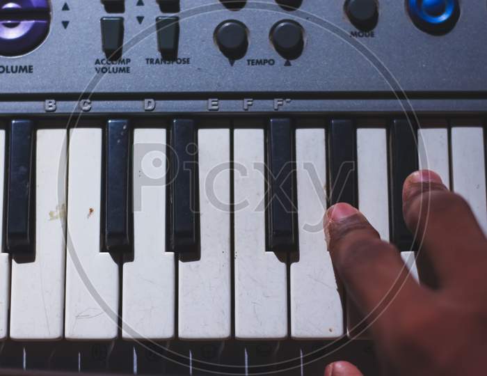 Playing Electronic Keyboard From Top View Composition In Music Recording Studio Close Up On Hands. Playing Electronic Piano.