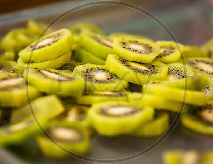 Healthy Green Kiwi Fruit Sliced In A Tray, Background