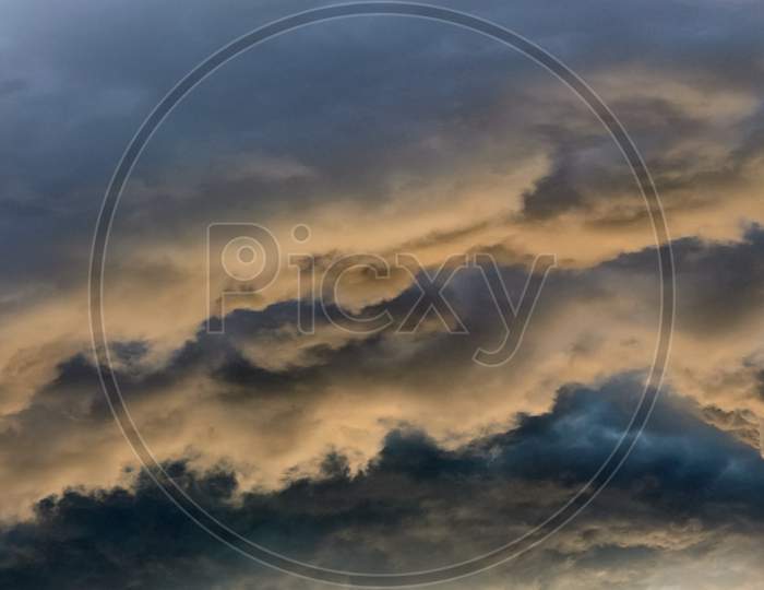 Beautiful panorama of orange and yellow cloudscapes at sunrise sunset  on a blue sky in high resolution