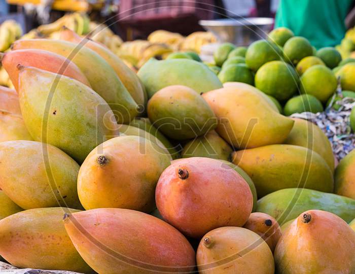 Pile Of Organic Mangoes And Other Fruits In Market, Background