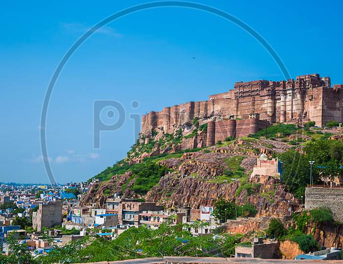 Jodhpur, Rajasthan, India - September 13Th, 2019: Beautiful View Of Blue City And Mehrangarh Fort On The Hill Against Clear Blue Sky - Image