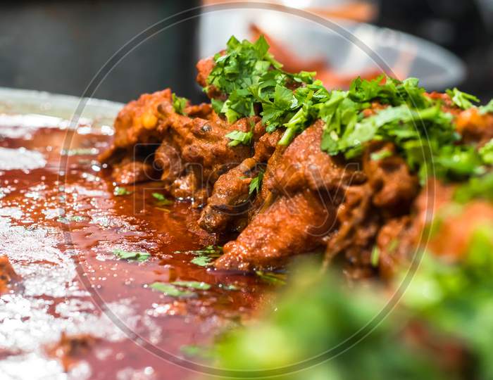 Indian Style Roasted Chicken Or Tandoori Chicken Garnished With Mint Leaves . Indian Non Vegetarian Food. - Imageindian Style Roasted Chicken Or Tandoori Chicken With Spicy Delicious Gravy, Indian Non Vegetarian Food. - Image