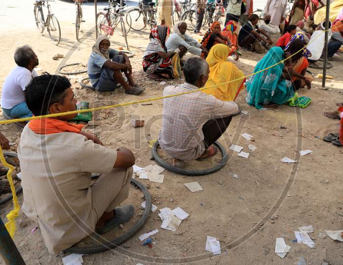 Villagers Waiting in Queue To Collect Free Ration  During Extended Nationwide Lockdown Amidst Coronavirus Or COVID-19 Pandemic in Prayagraj