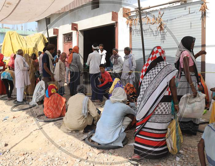 Villagers Waiting In Queue To Collect Free Ration  During Extended Nationwide Lockdown Amidst Coronavirus Or COVID-19 Pandemic in Prayagraj