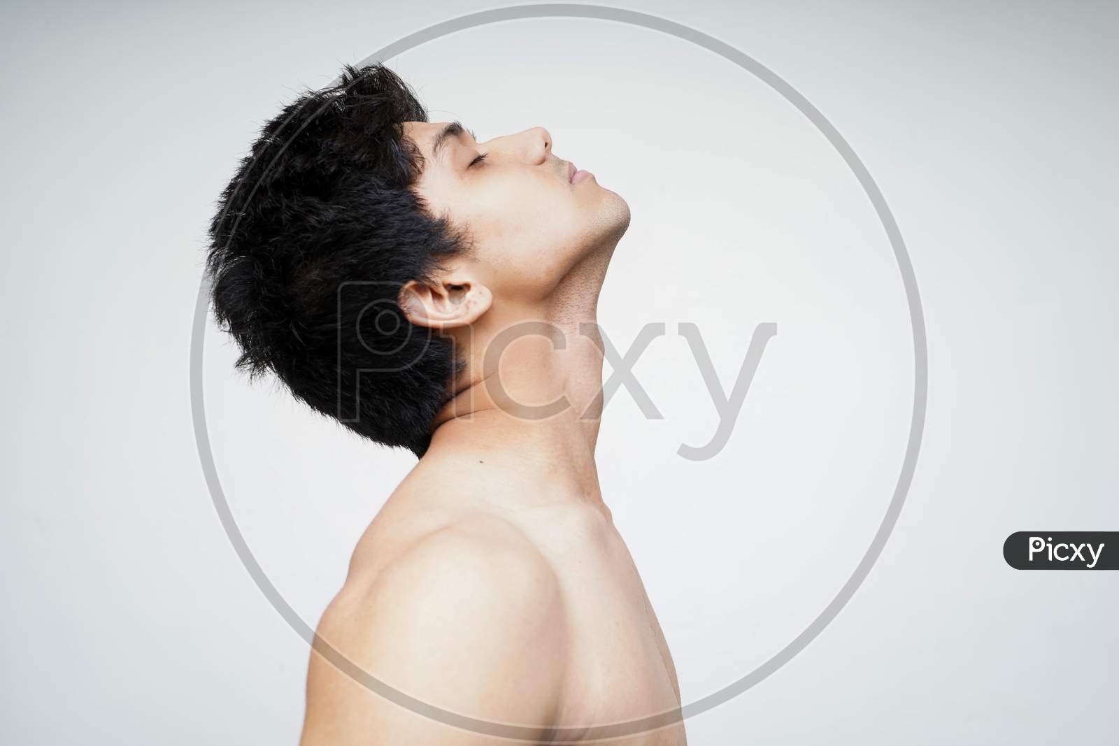 Sensual And Thoughtful. Portrait Of Handsome Shirtless Young Indian Male