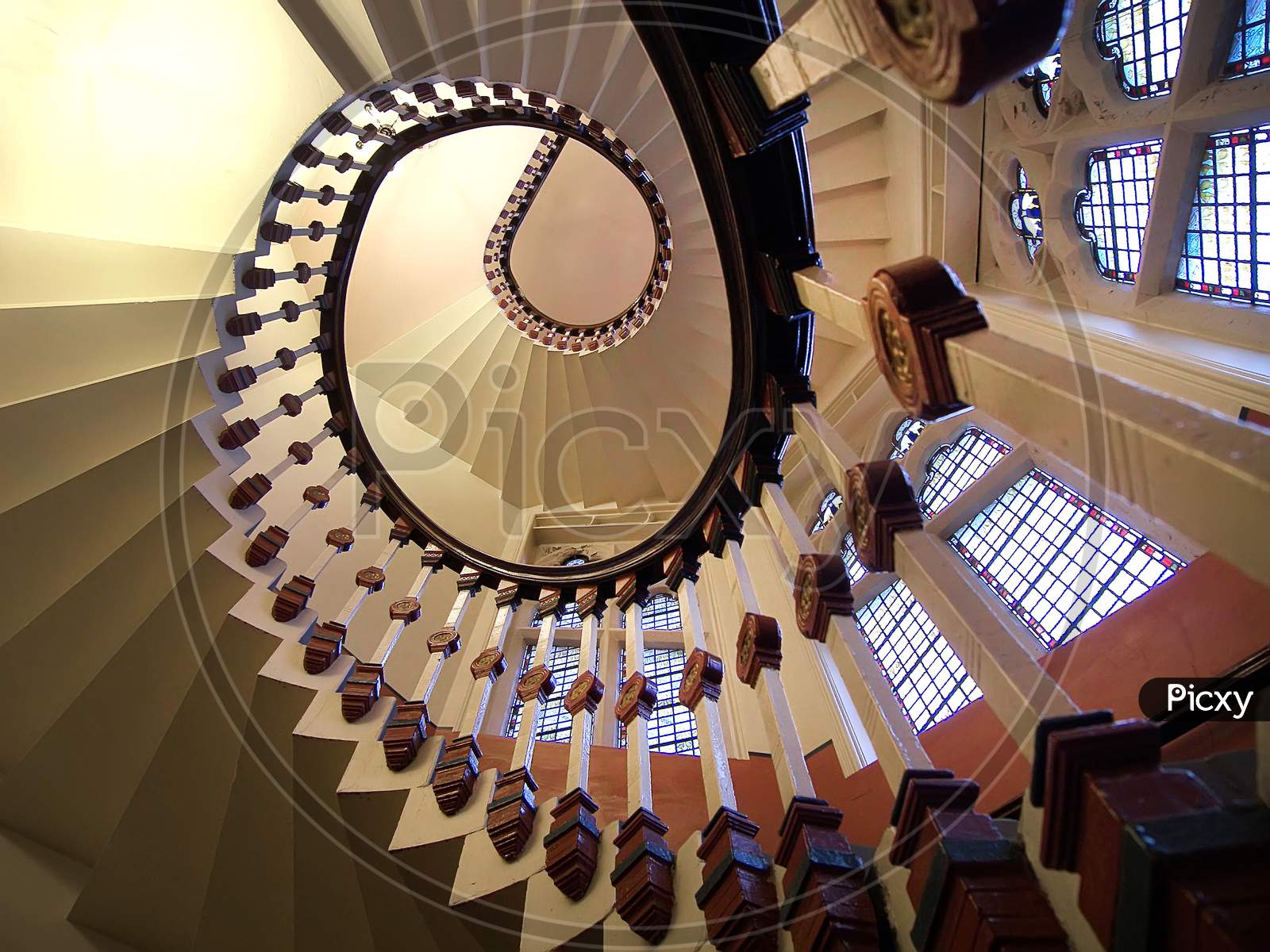 A spiral staircase looking up.
