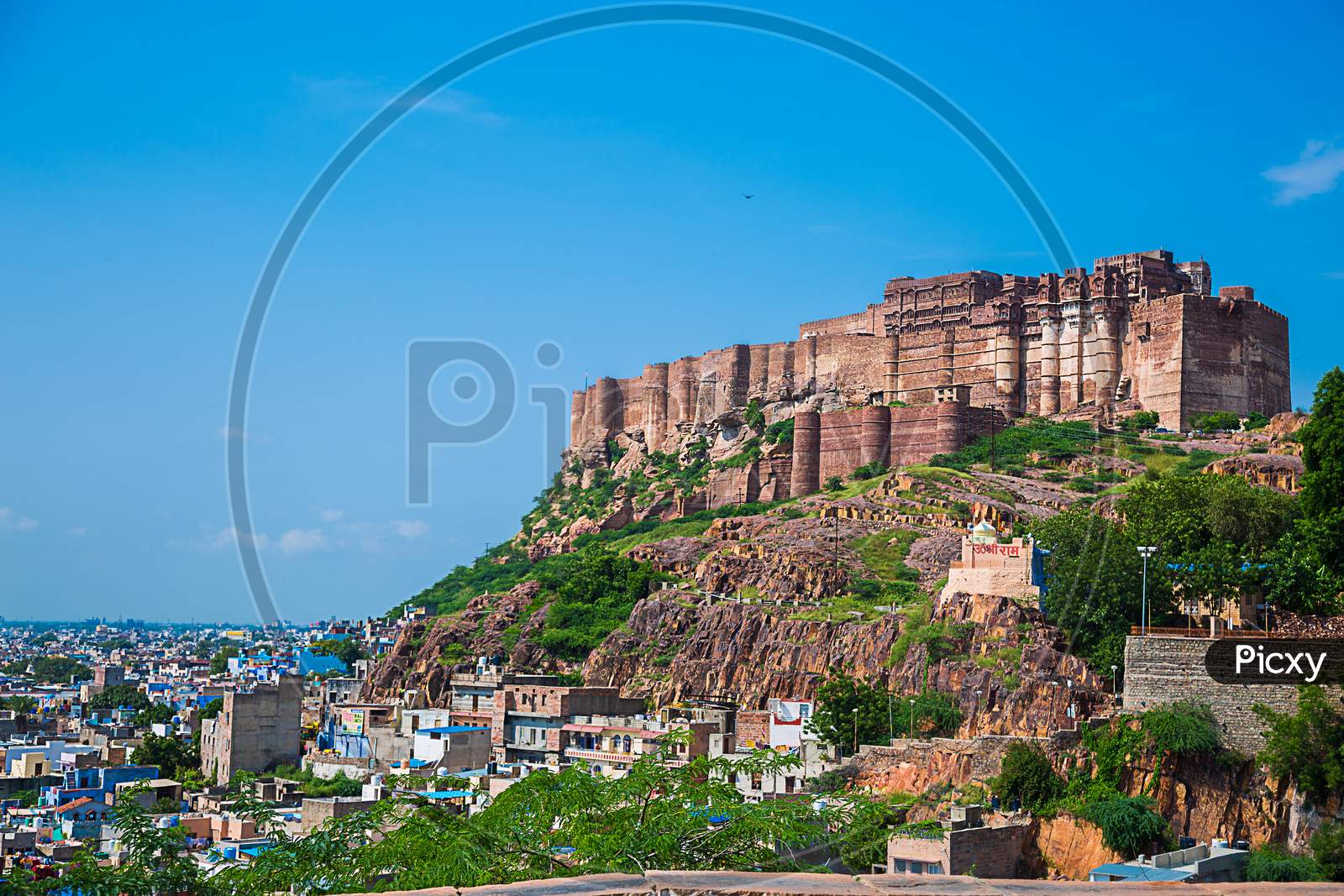 Jodhpur, Rajasthan, India - September 13Th, 2019: Beautiful View Of Blue City And Mehrangarh Fort On The Hill Against Clear Blue Sky - Image