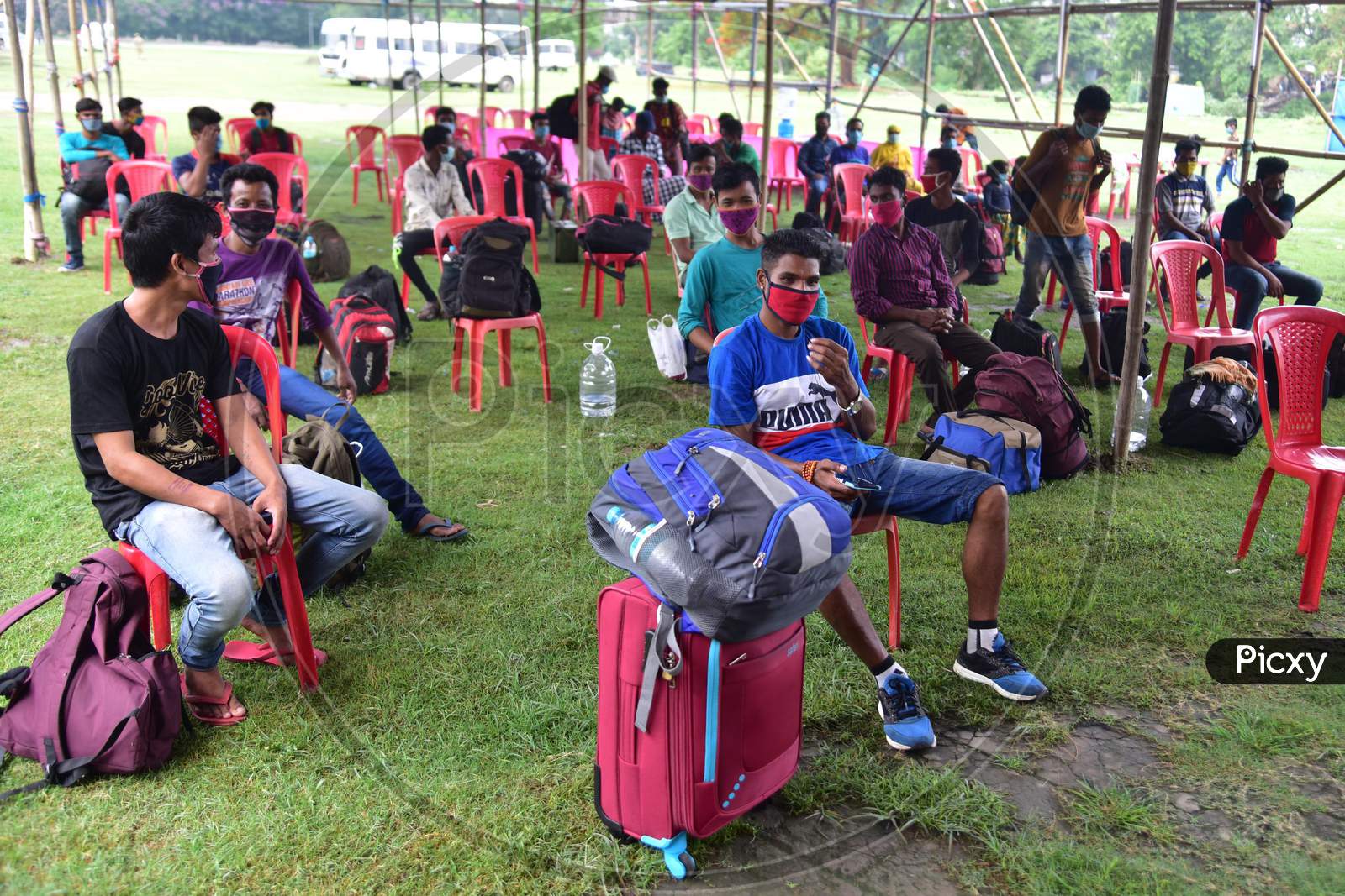 Migrants  Wait For  Swab Sample  Test After Arriving From Chennai Via Shramik Special Train During Nationwide Lockdown Amidst Coronavirus or COVID-19 Pandemic  In Nagaon District Of Assam,India
