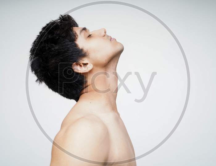 Sensual And Thoughtful. Portrait Of Handsome Shirtless Young Indian Male