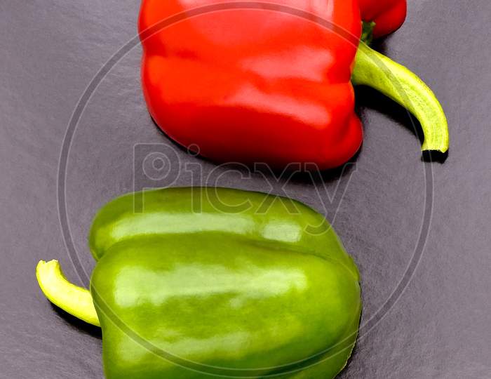 Two cut red & green peppers cut in pattern.