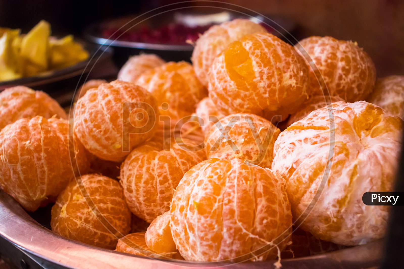 Heap Of Fresh Ripe Peeled Oranges Or Tangerines In A Bowl - Image