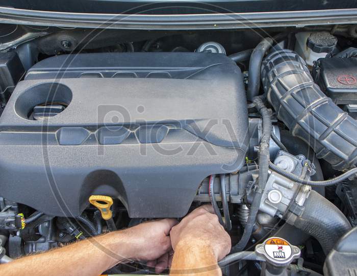 Mechanic Repairs Car Engine