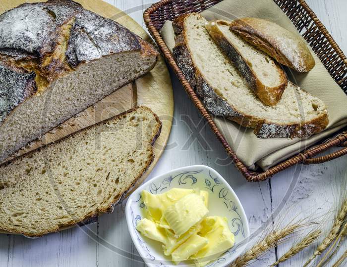 A loaf of freshly baked rye bread sliced