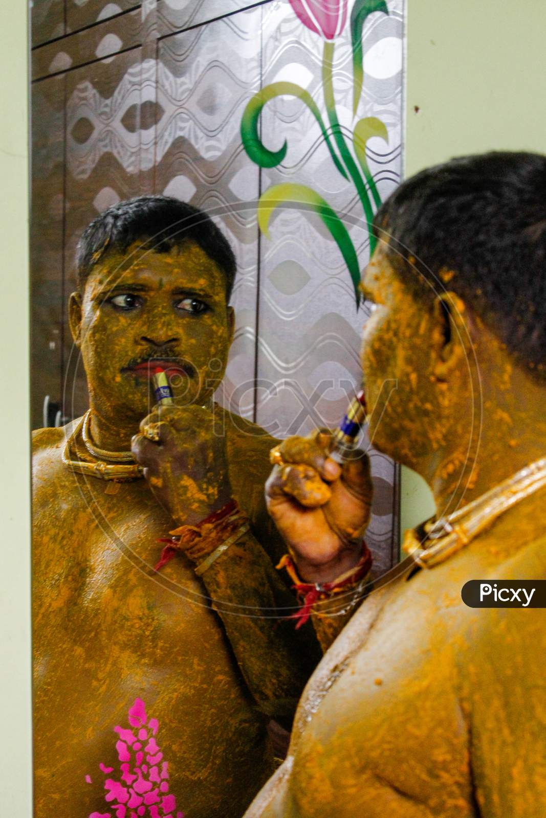 devotee making up for the bonalu event