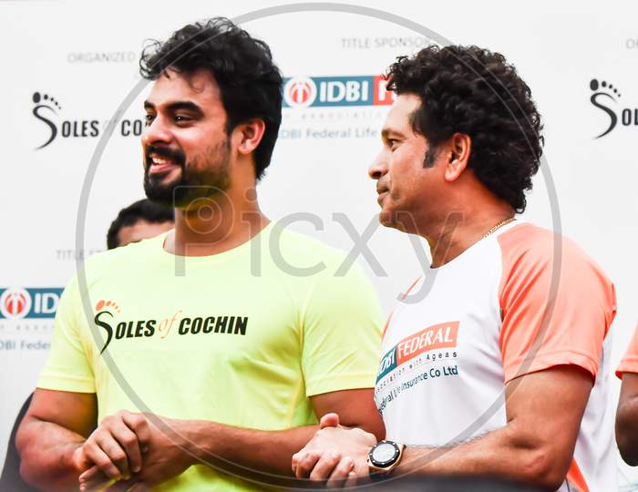 actor Tovino Thomas With Cricketer Sachin Tendulkar Inaguration Of Spice Coast Marathon In Kochi