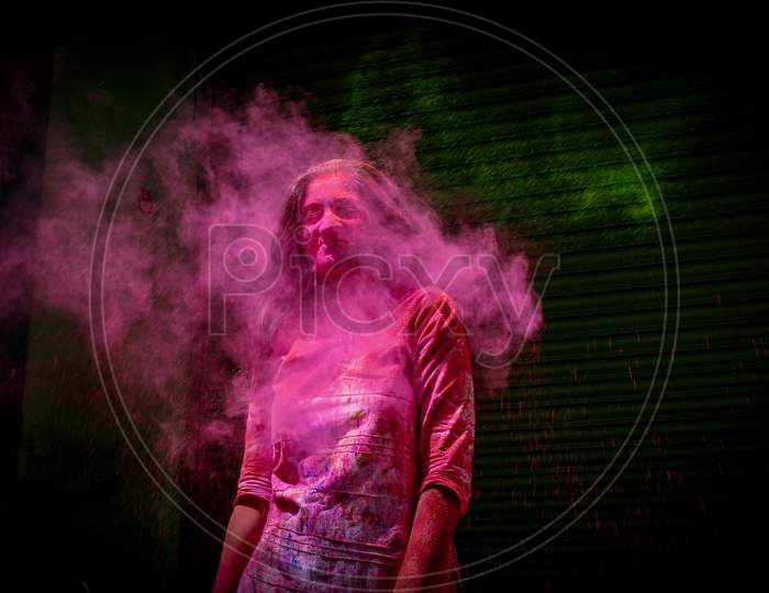 colored splashed on a girl in holi festival