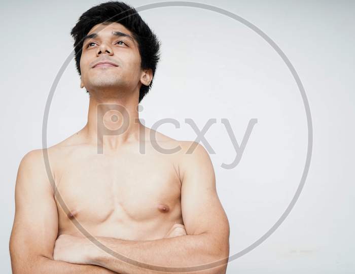 Motivating And Smart. Portrait Of Young Indian Boy Looking Upwards