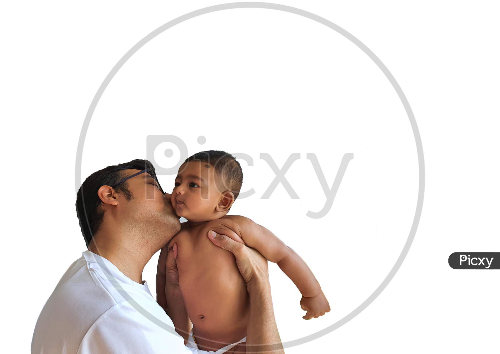 A Father In Glasses Kissing A Little Boy On His Lap In White Background