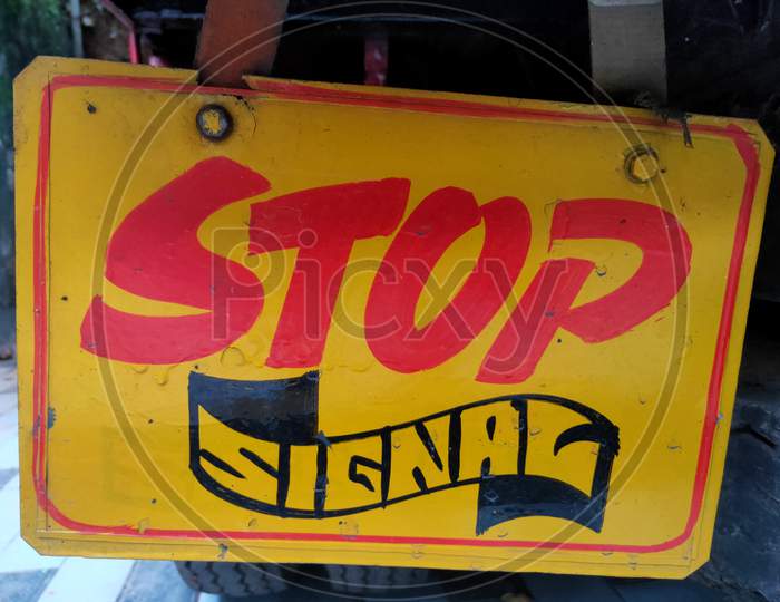 Yellow board stop sign