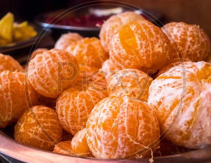 Heap Of Fresh Ripe Peeled Oranges Or Tangerines In A Bowl - Image