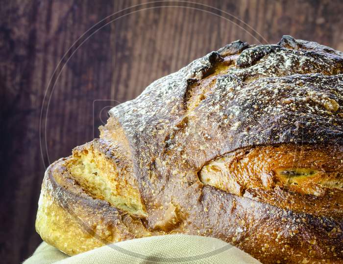 Freshly baked sourdough bread made with dark rye flour.