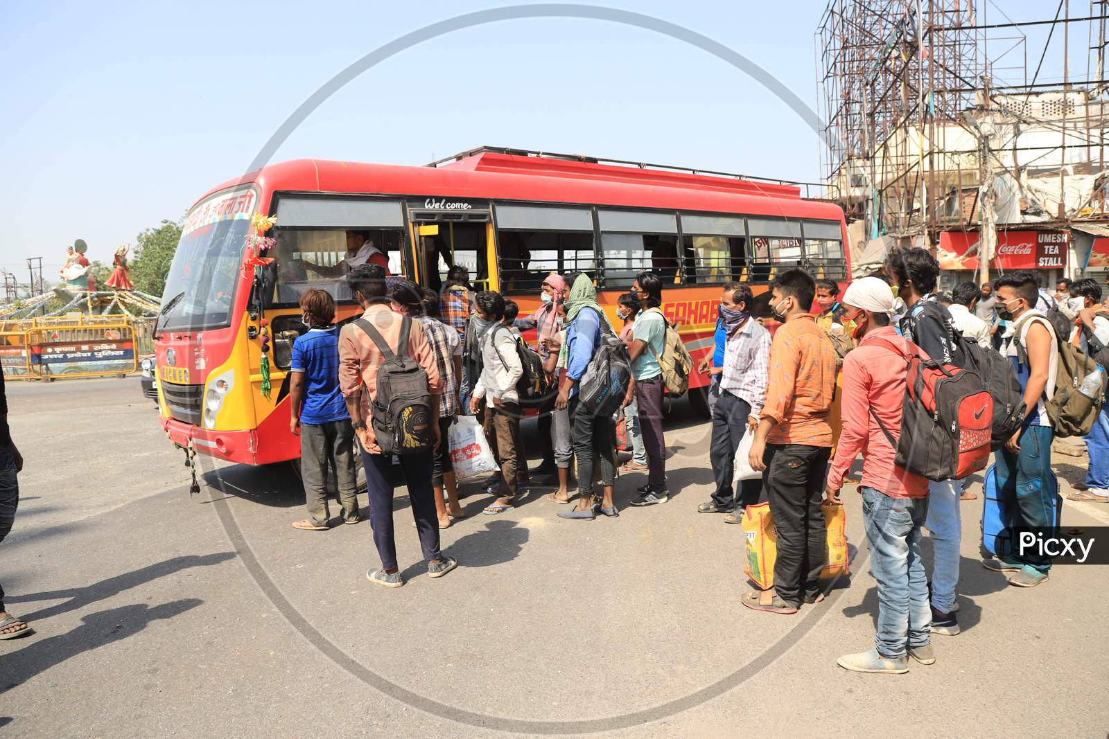 Migrant Workers Boarding Buses To Their Native Places During Extended Nationwide Lockdown Amidst Coronavirus Or COVID-19 Pandemic in Prayagraj