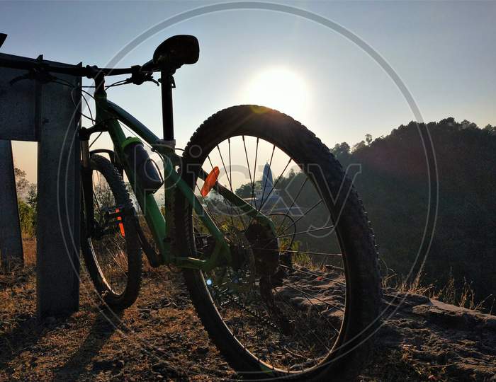 Mountain bike on the hills during sunset