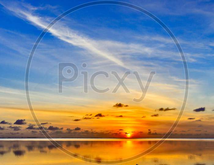 Beautiful Sunset Over Sky On Sea in Maldives  With Horizon