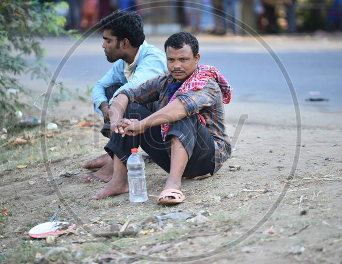Migrant workers from West Bengal and Bihar wait for permission to cross Telangana State at a Checkpost in Aswaropeta during an extended lockdown amid coronavirus fears, May 16,2020.