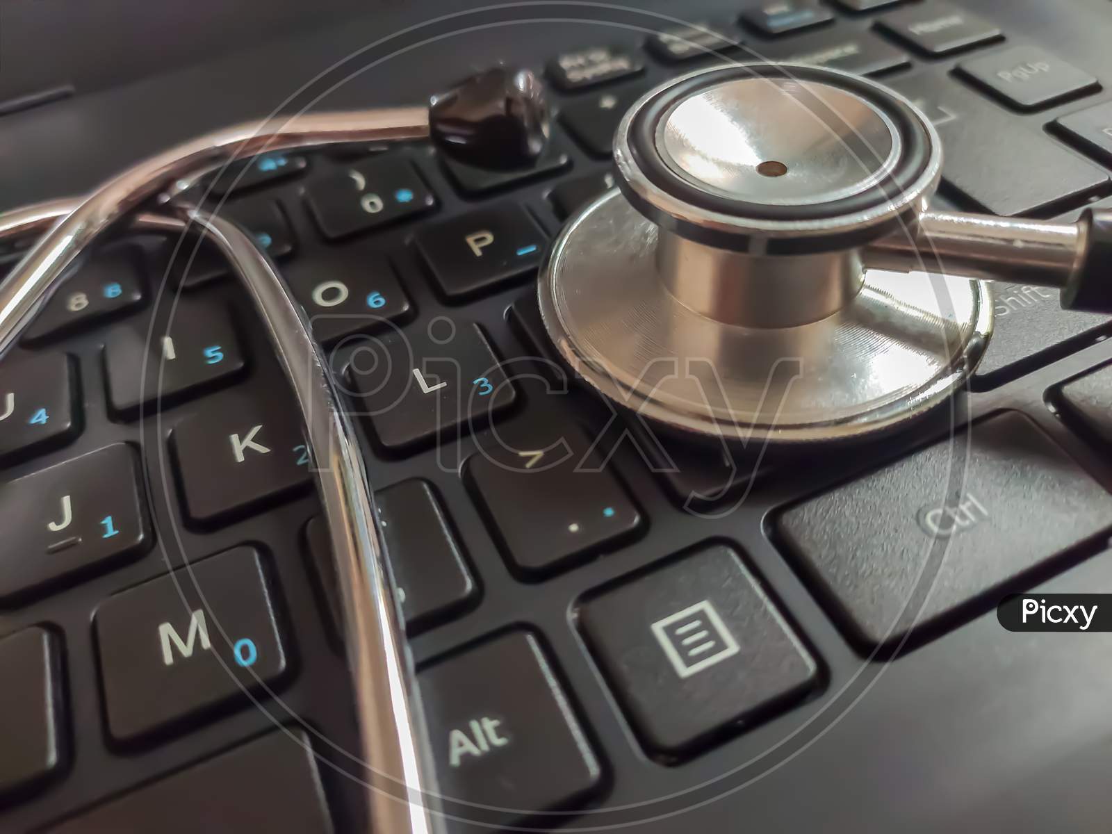 Medical Stethoscope On Laptop Keyboard
