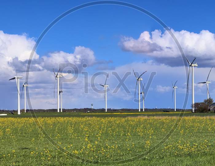 Detailed panorama of wind energy parks in northern germany close to the north sea
