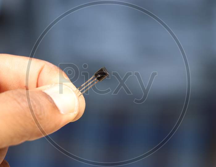 Small Electronic Component Or Hardware Held In Hand