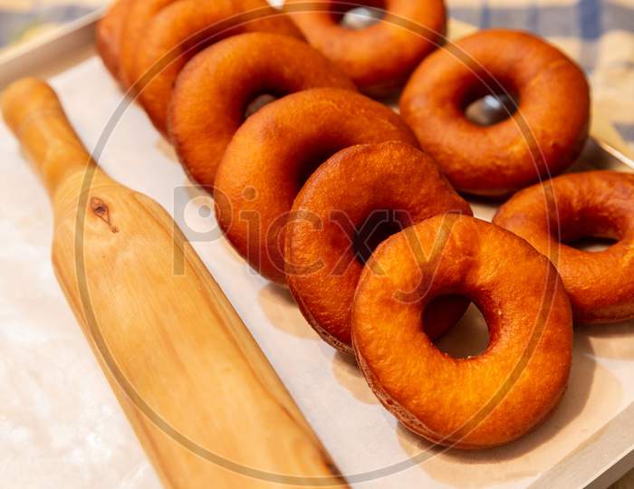 Freah Fried Doughnut Or Donut Kept On Tray For Next Processing
