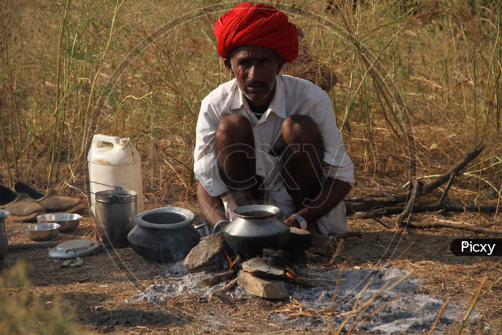 A Camel Trader Cooking Food At Pushkar Camel Fair, Pushkar