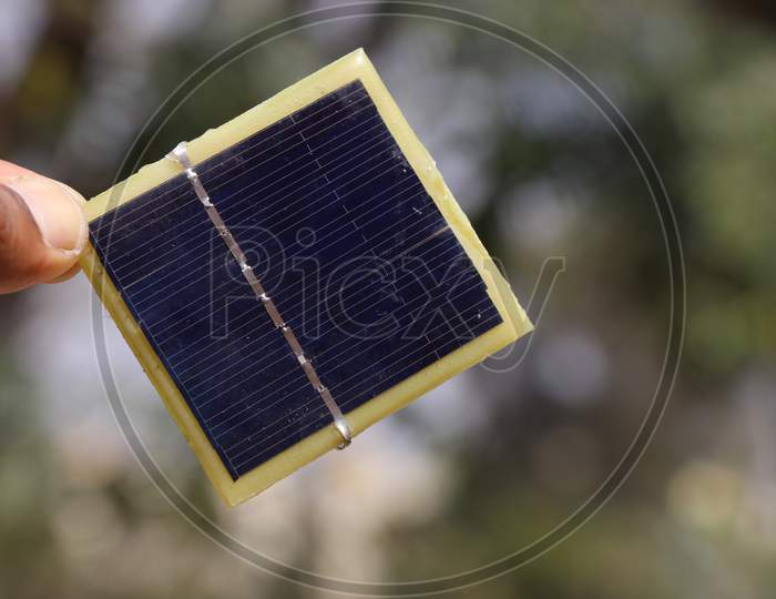 Solar Panel Also Called As Solar Cell Held In Hand