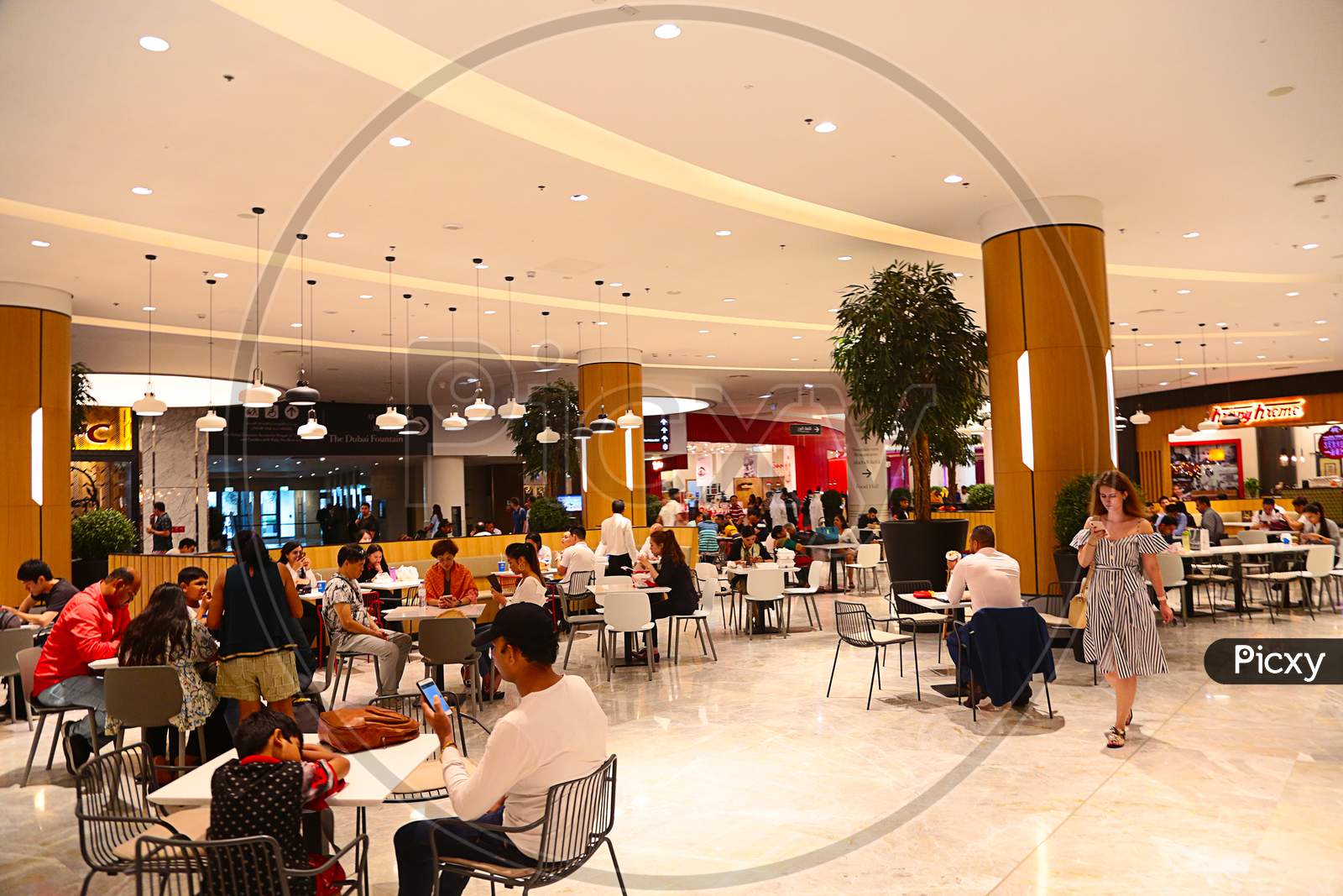 Dubai, United Arab Emirates - June 18Th, 2019: The Dubai Mall Inside View People Sitting In Food Court - Image