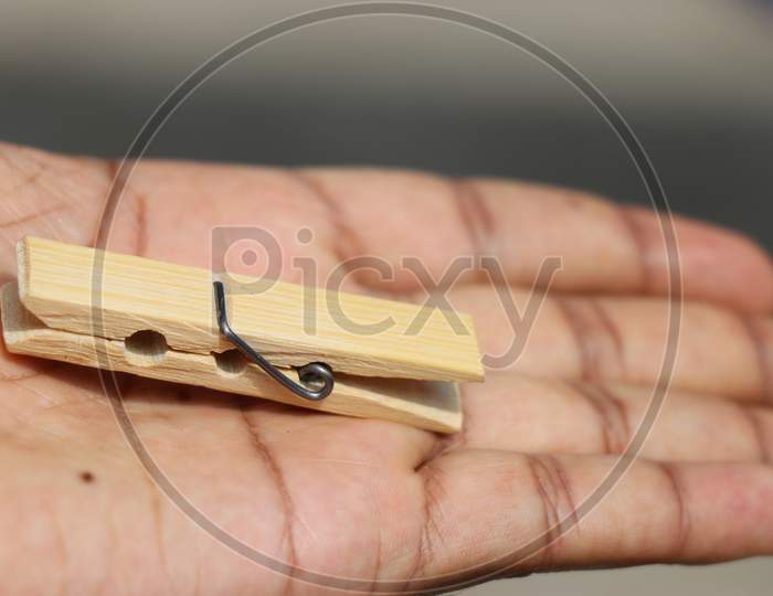 Cloth Hanging Clip Made Of Wood Held In Hand