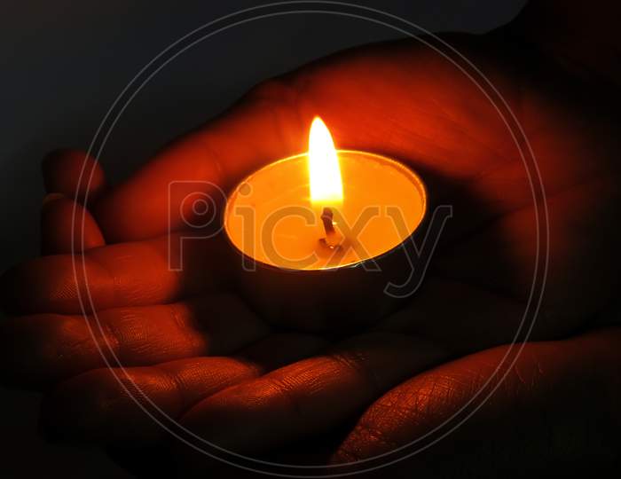 Hand holding a candle,Candle Light,Beautiful Candle in Hand.hand with candle.